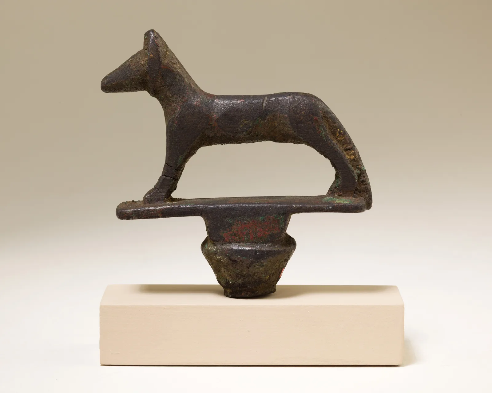 Egyptian standard with the figure of a reclining jackal