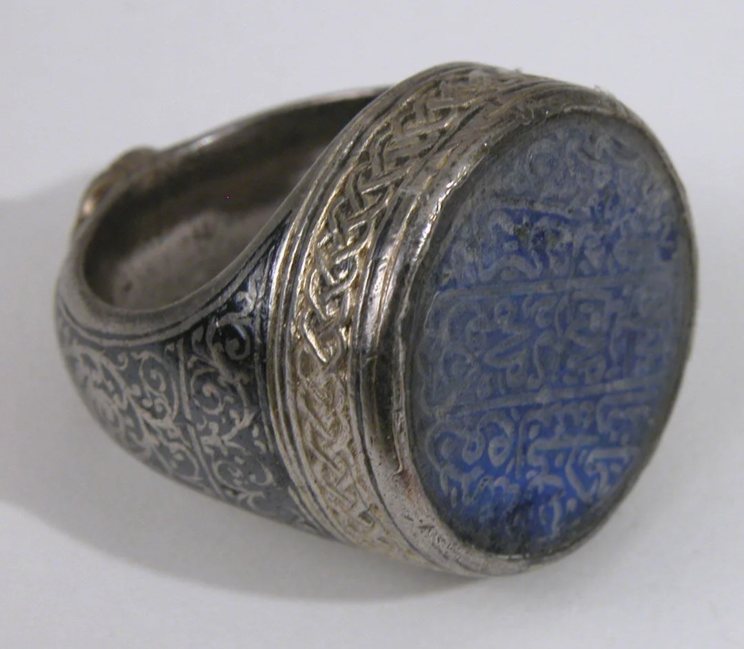 Seal ring with the owner's name carved on a lapis lazuli bezel, gilded silver band