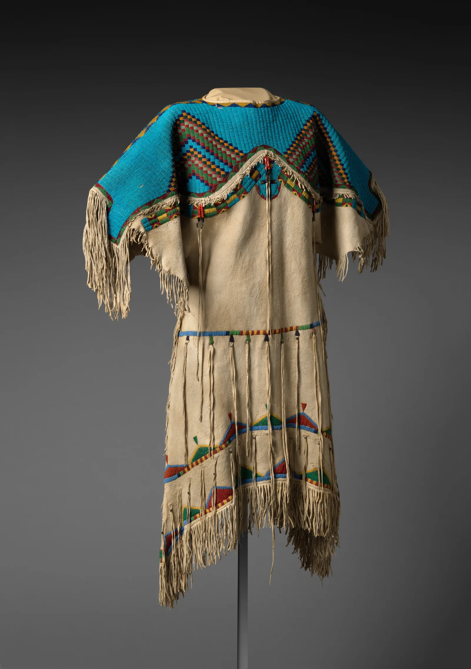 Lakota hide dress densely embroidered with glass beads across the yoke
