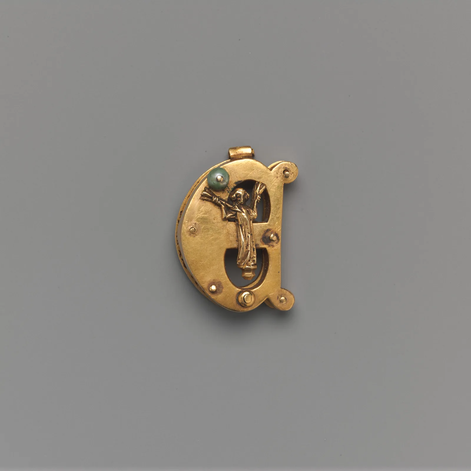Gold brooch in the shape of the letter E with a small figure, Germany, about 1340 to 1360