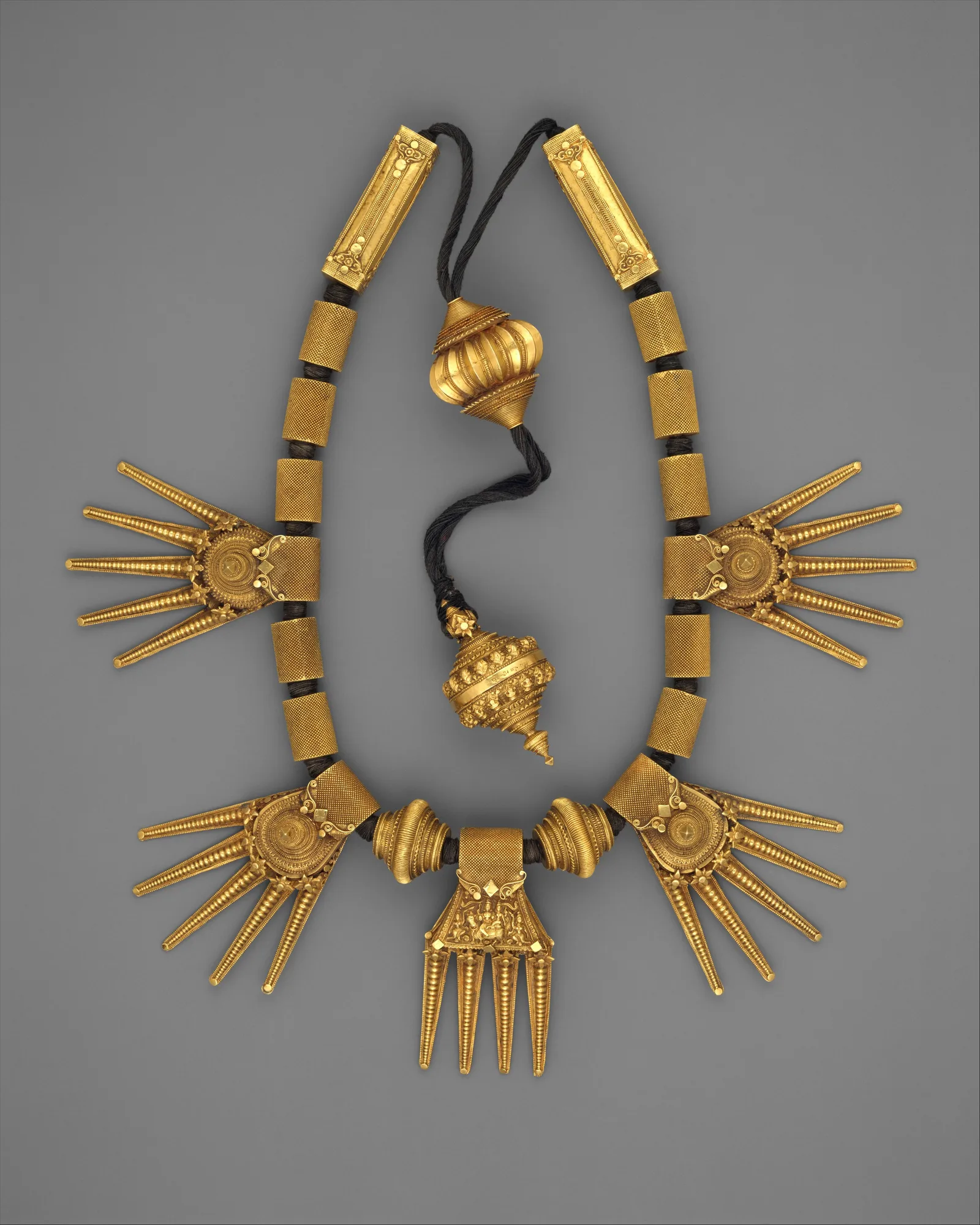 Gold wedding necklace (thali) strung on black thread, Tamil Nadu, late nineteenth century