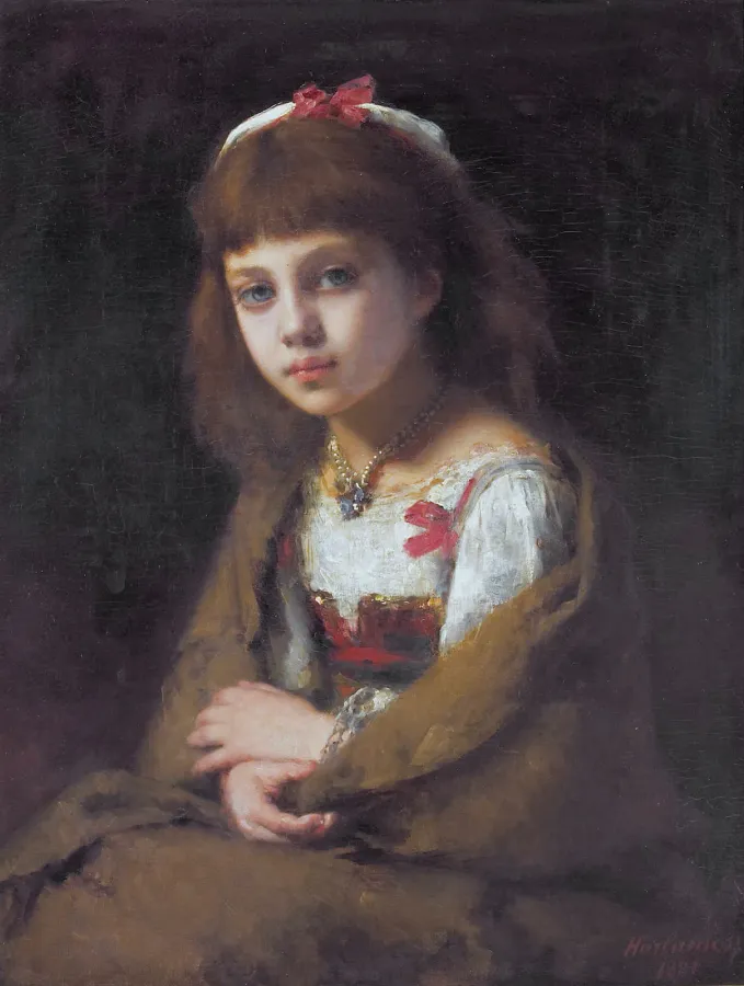 Young girl with a pearl choker necklace in a formal portrait