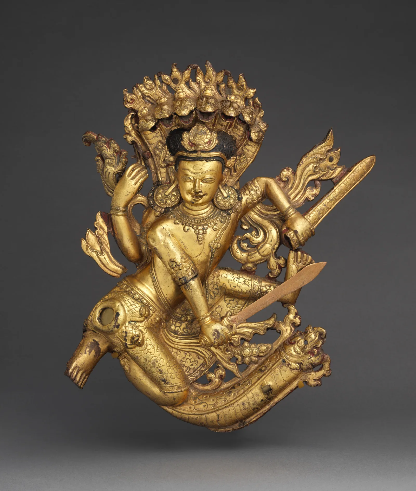 Krishna in jewelry: the blue-skinned god of love with a flute, a peacock feather and a tale of stolen butter