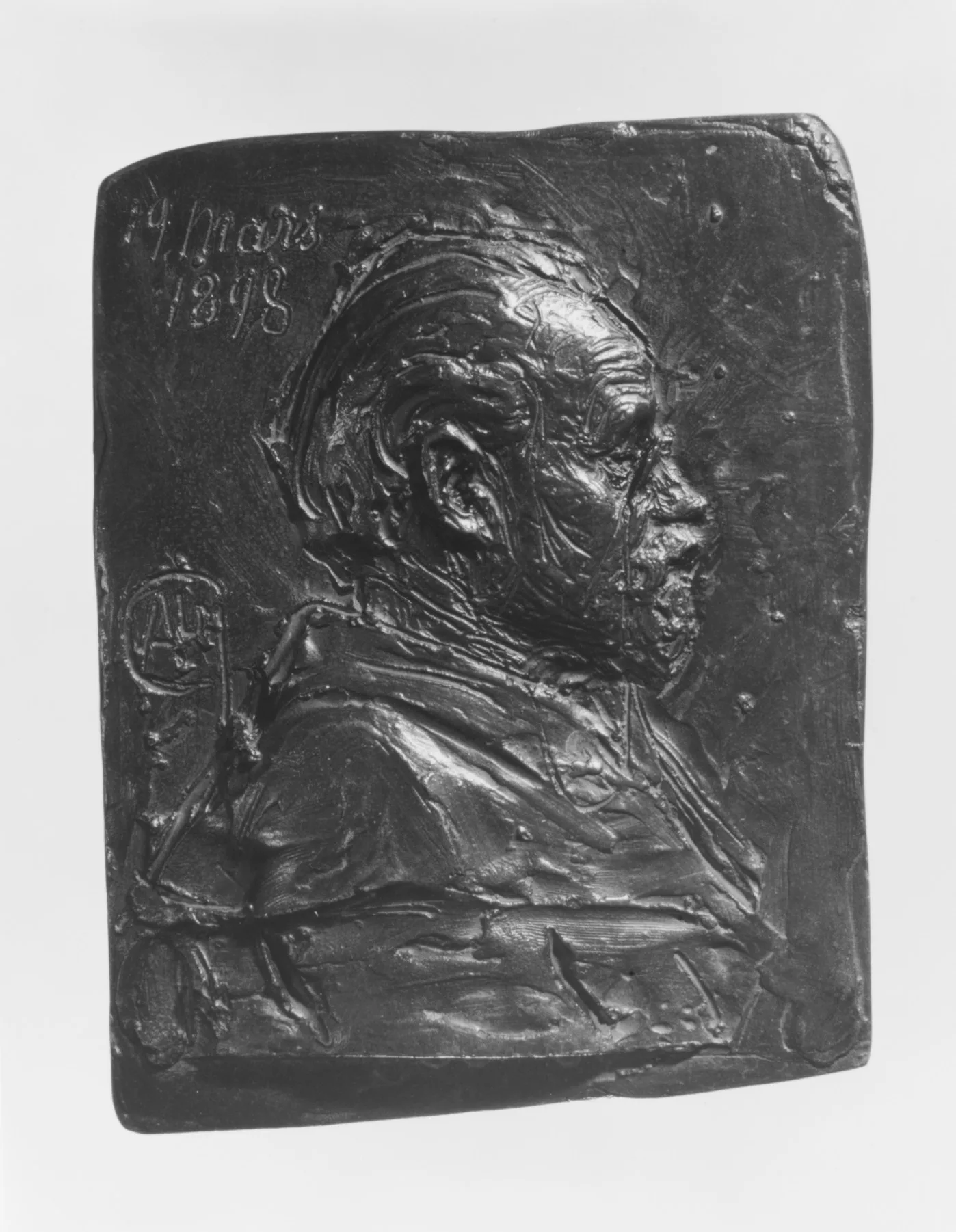 Relief de portrait en bronze d'un médailleur, profil en buste sur une plaquette
