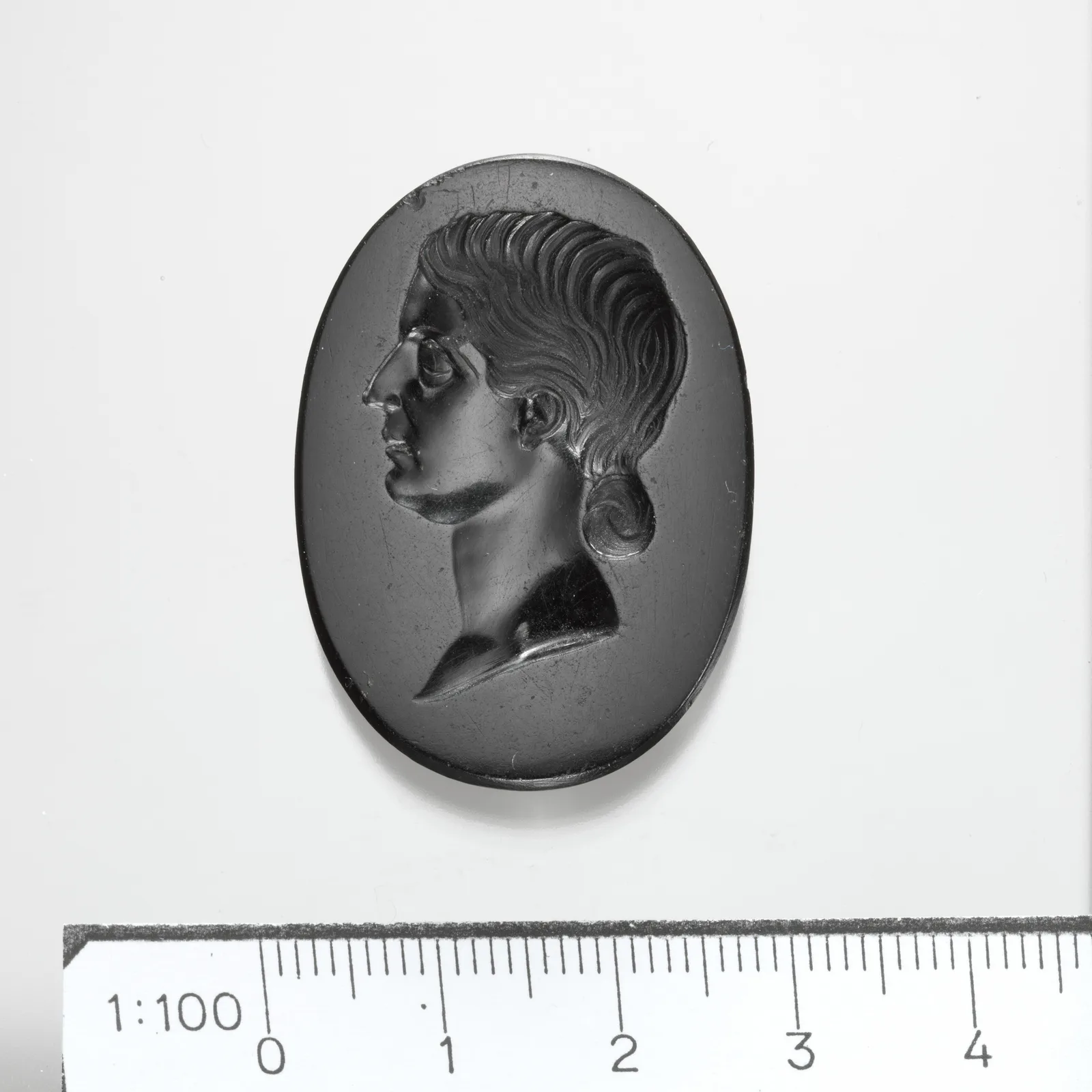 Ancient intaglio in black jasper with the profile portrait of a Roman woman