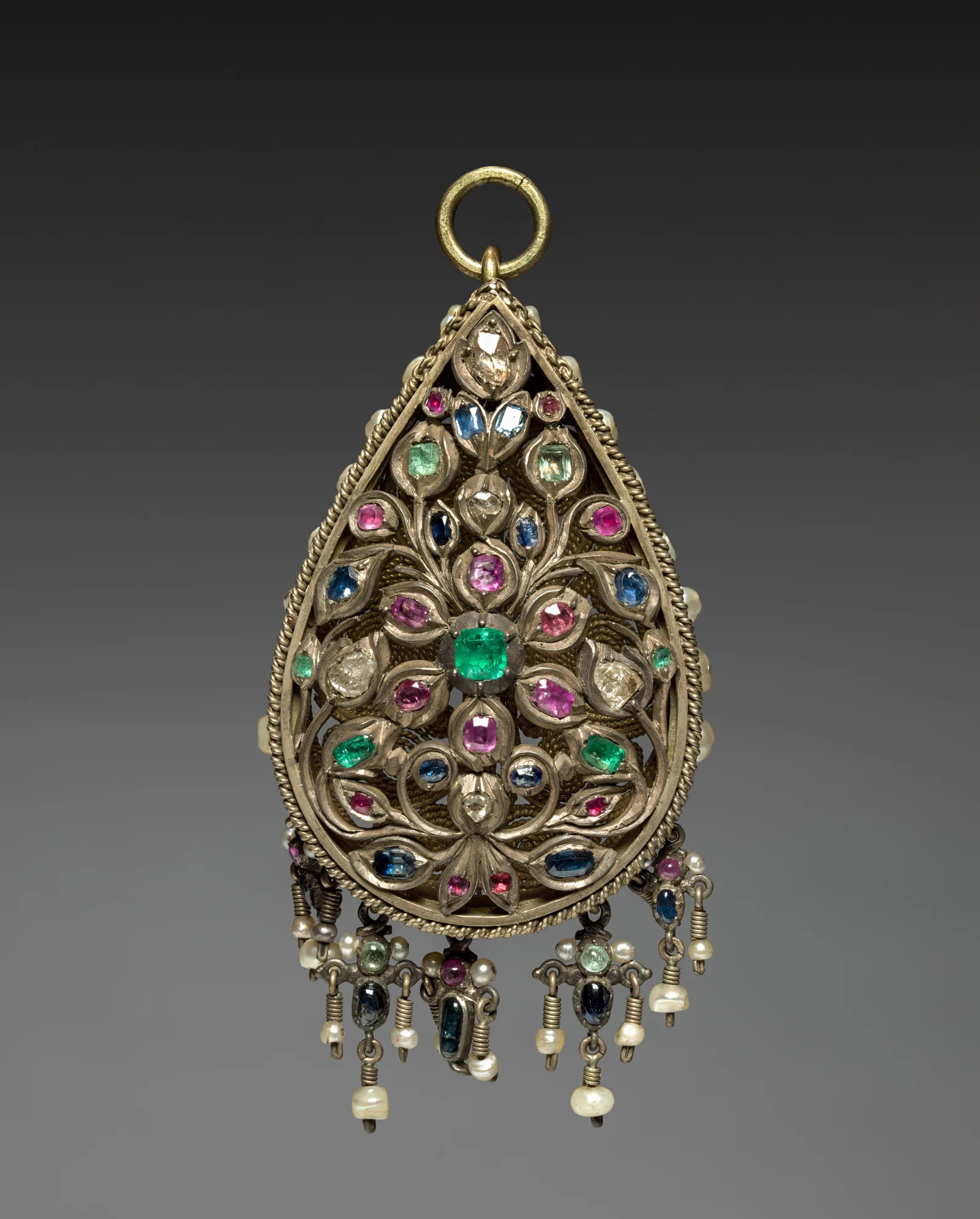 A Balkan silver pendant of the nineteenth century with hanging coins and filigree