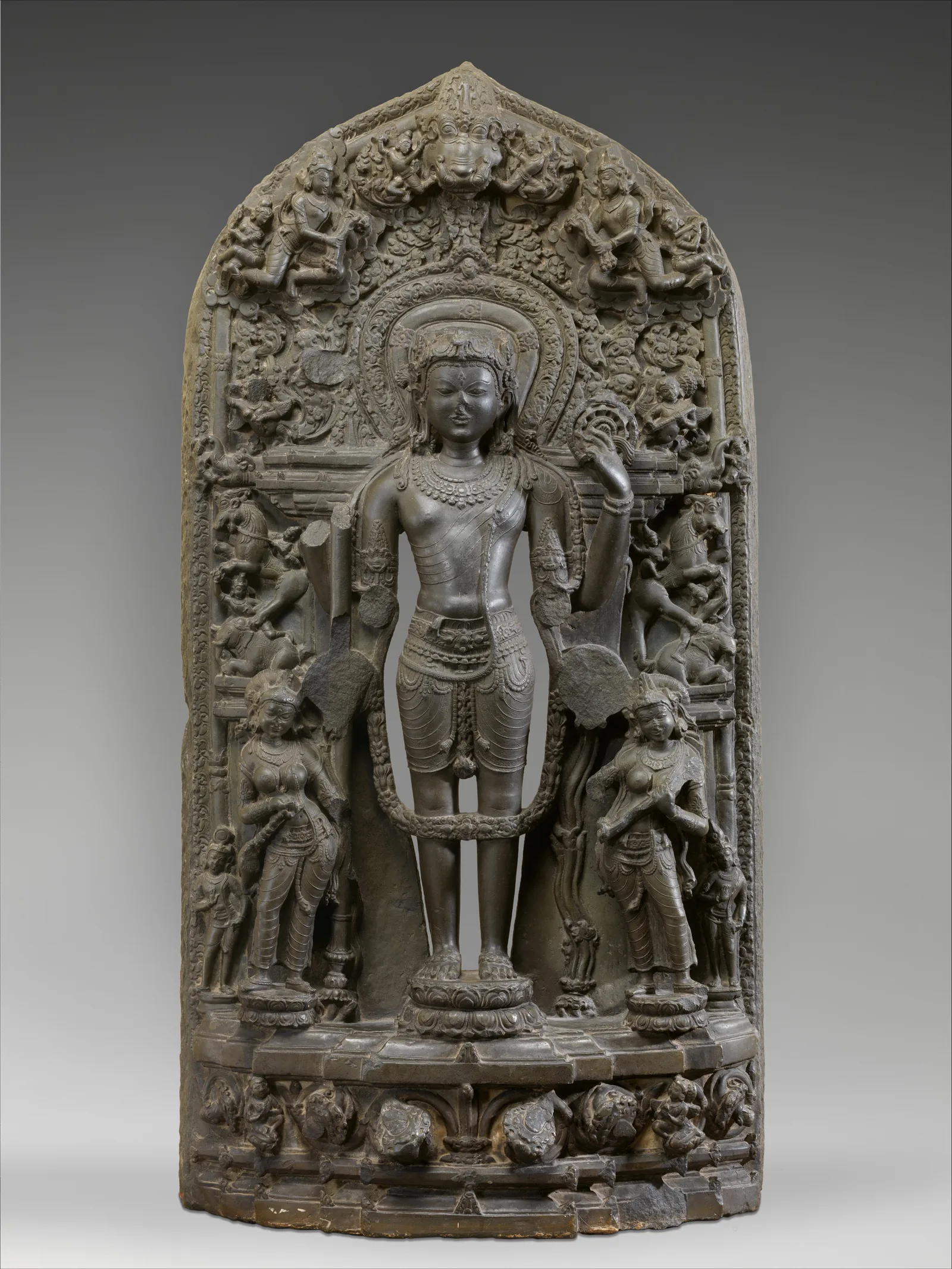 Carved stone stele of Vishnu flanked by standing Lakshmi and Sarasvati, black phyllite, 12th century, Bangladesh