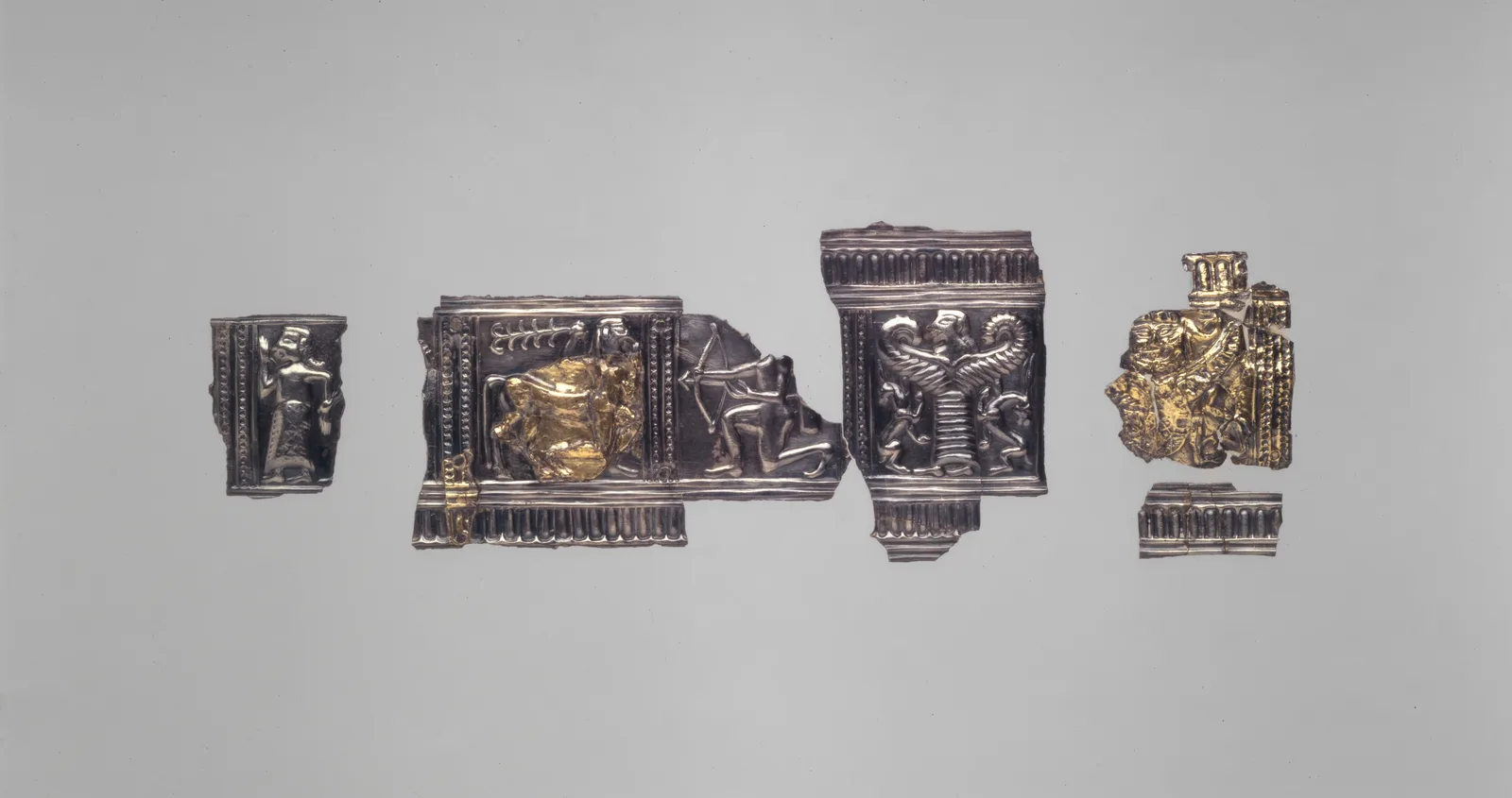 Ancient Greek gilded silver relief, gold laid over a silver base